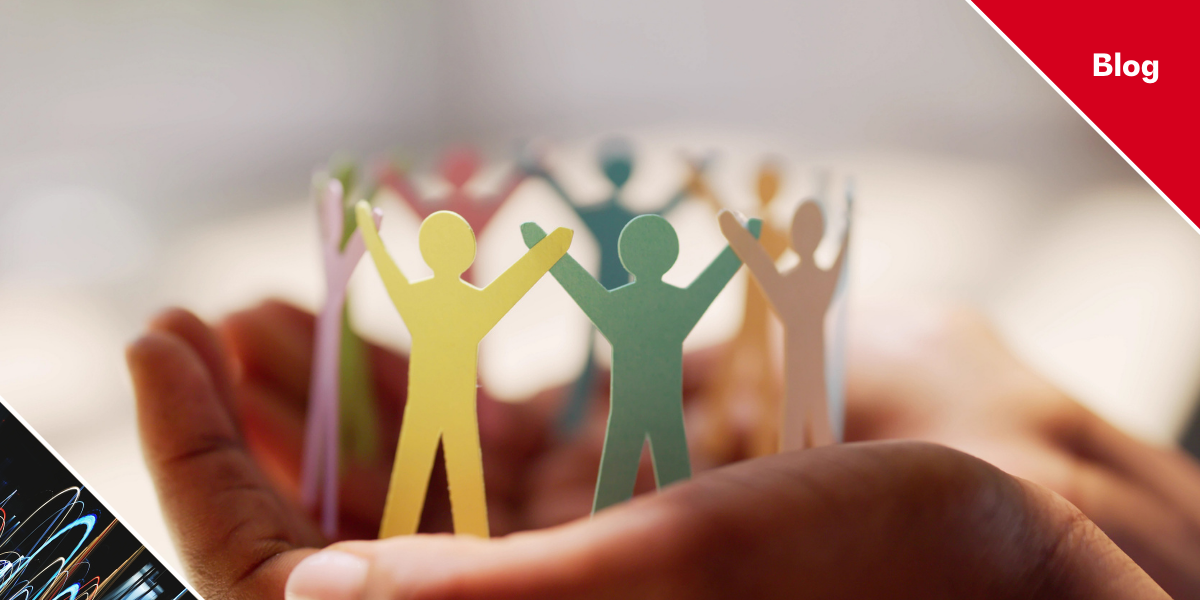 Paper people in hands